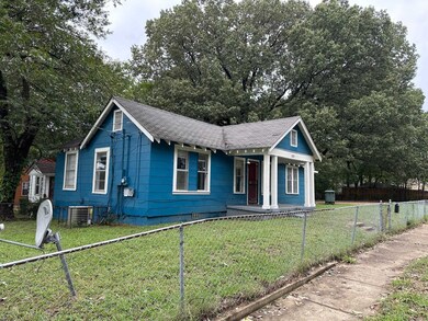 View of front of property with a front yard and ce