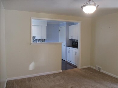 Formal dining room into kitchen area