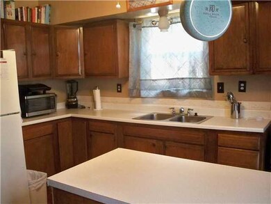 Kitchen. The kitchen has lots of cabinetry and lam