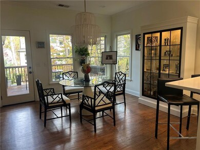 DINNING AREA WITH LOTS OF WINDOWS LEADING TO BACK DECK FOR EASY ENTERTAINMENT