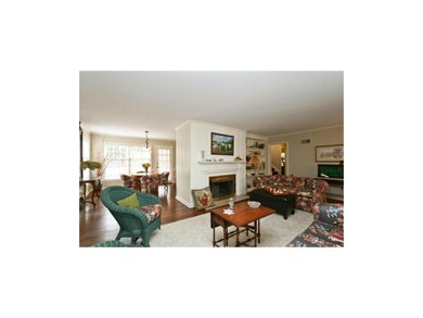 Living room open to dining room.