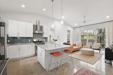 Kitchen with wall chimney range hood, gas stove, 