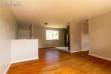 Spare room with light wood-type flooring and baseboards