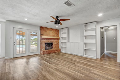 Unfurnished living room with a textured ceiling, 