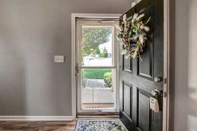 Storm door with pull down top w/screen