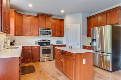 Move in ready . . . tile backsplash with a beautiful herringbone pattern . .  large corner pantry