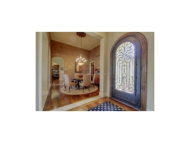 Gleaming wood floors upon entry.