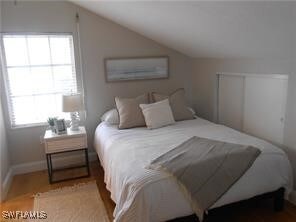 Bedroom featuring vaulted ceiling