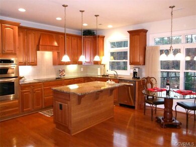 Gourmet kitchen features large island, double wall
