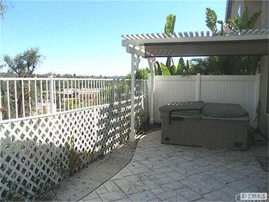 Rear patio with above ground spa