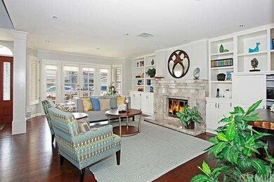 Living room opens to sunny front patio.