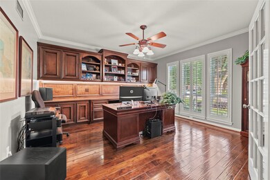 Home office with custom built-ins, crown molding,