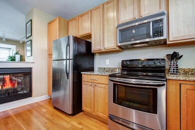 Upper Green kitchen showing fireplace