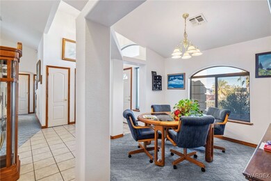 Dining space with light tile patterned flooring, l