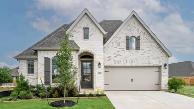 French country style house featuring driveway, a 