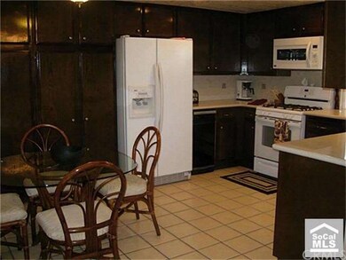 View of Kitchen showing Fridge, oven & eating area