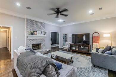 Spacious living room with floor to ceiling brick f