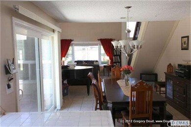 Kitchen opens to Dining Room and Living Room.