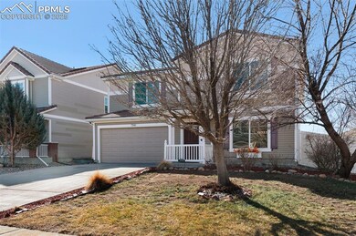 Traditional-style home featuring driveway, an atta