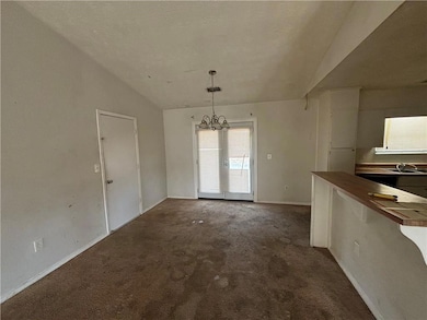Unfurnished dining area featuring a notable chande