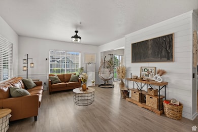 Living room featuring wood finished floors and a textured ceiling