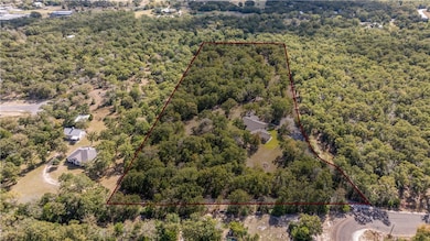 Aerial overview of property's location with property parcel outlined