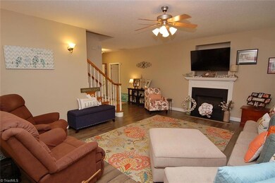 The gas log fireplace adds warmth to an already inviting room.