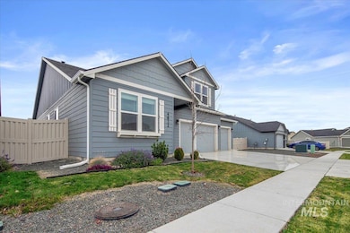 View of front facade with concrete driveway and an attached garage
