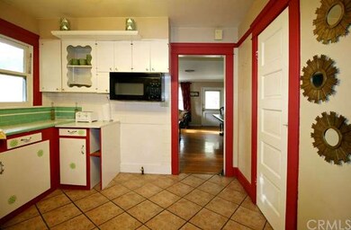 Kitchen with tile floor, two pantries (one of whic