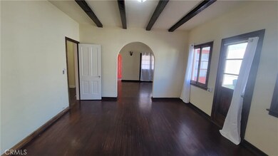 View of dining room towards arched living room