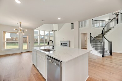 Kitchen featuring a chandelier, pendant lighting, white cabinetry, dishwasher, and recessed lighting