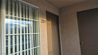 Property entrance featuring stucco siding