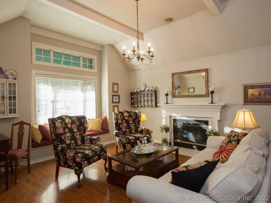 The formal living room has a gas log fireplace.