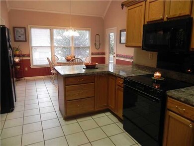 Ample cabinetry, tile, pantry, new microwave, high