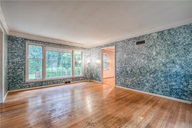 Spacious living room with hardwood floor throughou