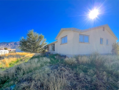 View of side of property featuring brick siding