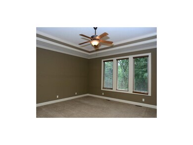 1st floor master bedroom with ceiling fan, blinds 
