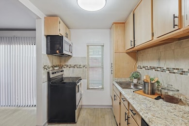 Kitchen with appliances with stainless steel finis