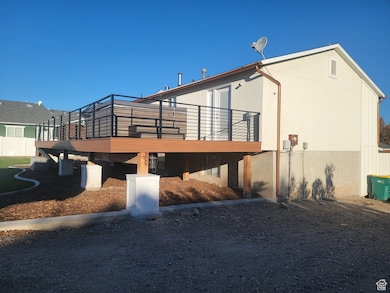 Rear view of property with a deck