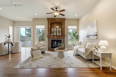 Lovely living room with gleaming HW floors