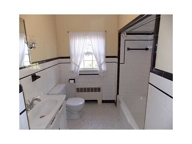 Bathroom. Good-sized black and white tiled bathroo