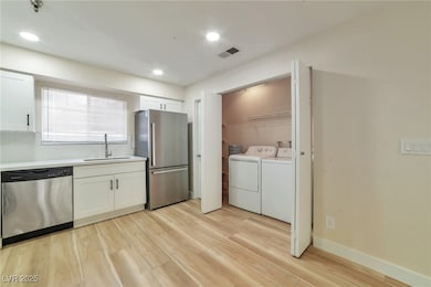 Laundry area featuring washing machine and dryer,