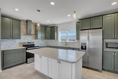 Kitchen with island solid surface counters painted