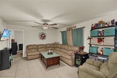 Tiled living room with ceiling fan