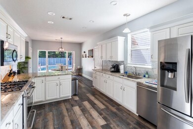 Updated flooring, granite countertops and vinyl wo