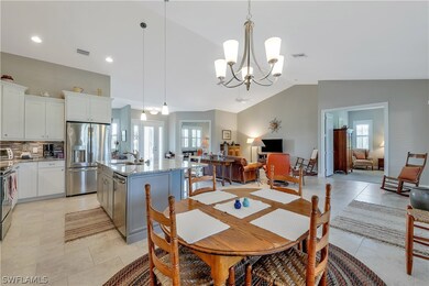 View of breakfast area, den and double doors leadi