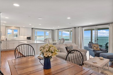 Open concept design boasts ocean views from kitchen, living room and dining room.