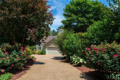 Welcoming driveway lined with roses.  Extra parkin