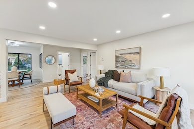 Living area featuring recessed lighting and light wood-style floors