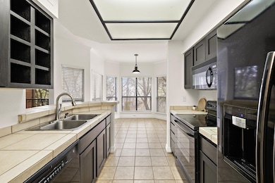 Kitchen featuring black appliances, ornamental mo